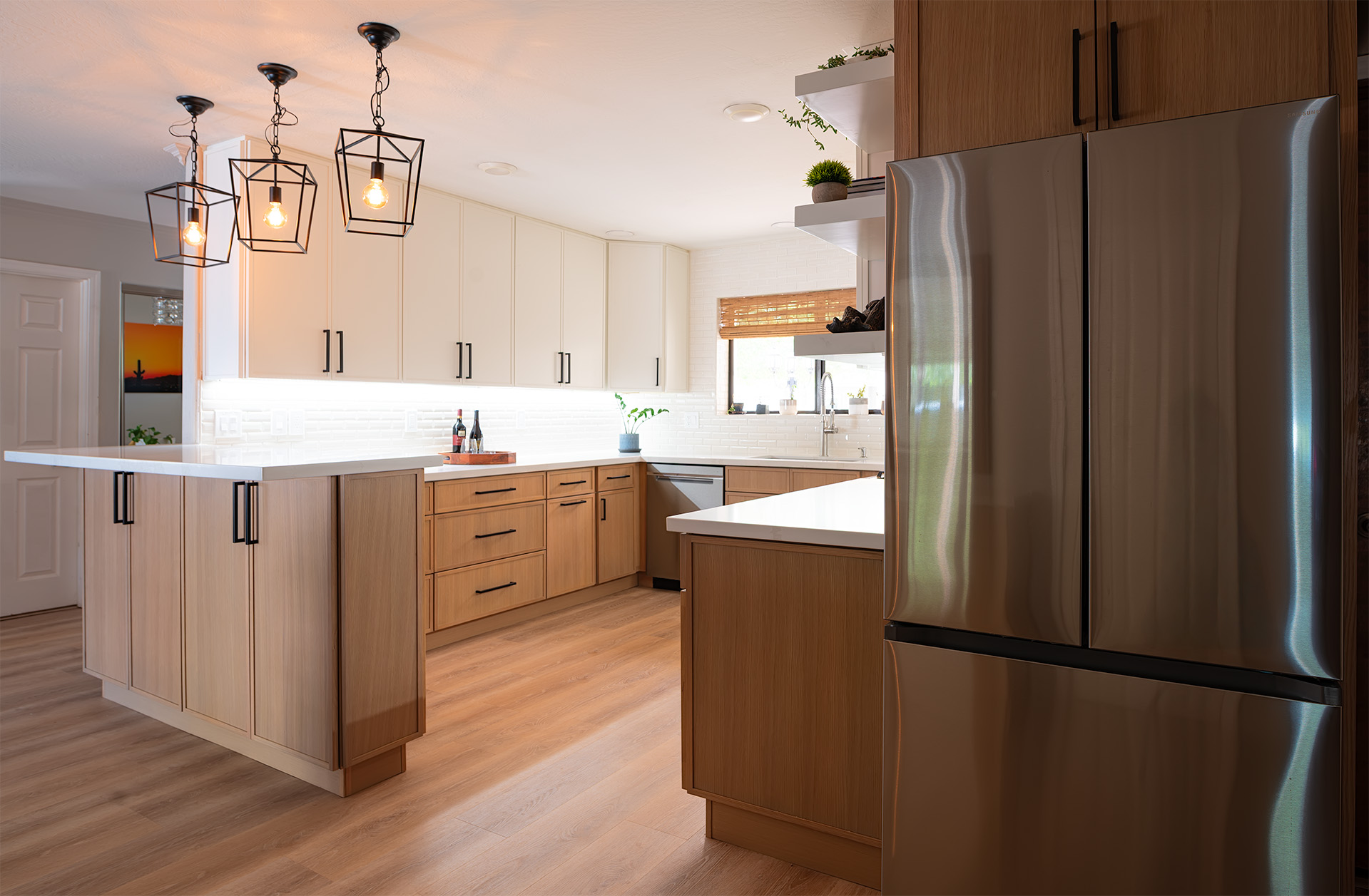 White oak kitchen remodel in Phoenix with an open layout and island seating