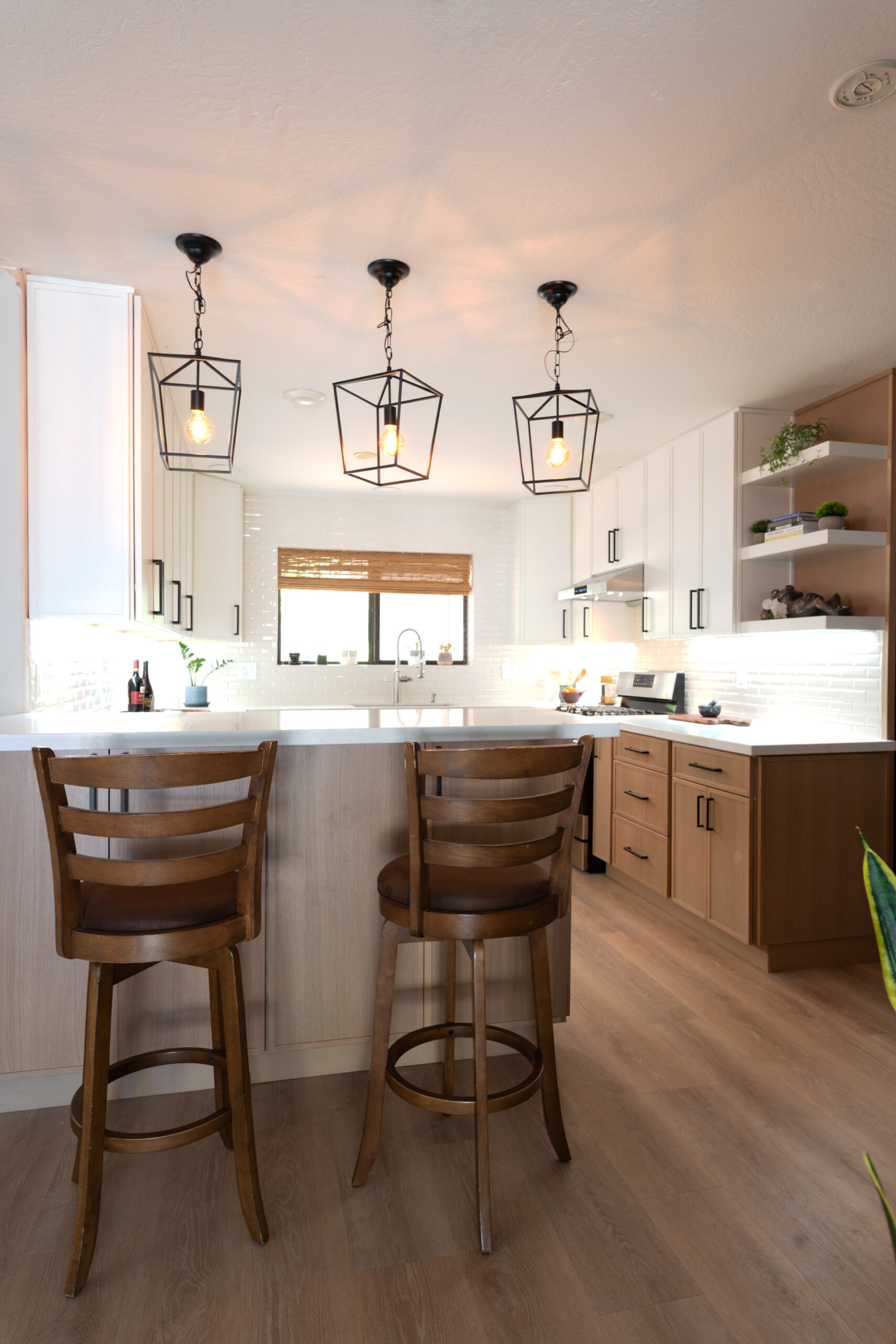 Completed Phoenix kitchen remodel with custom cabinetry and island seating