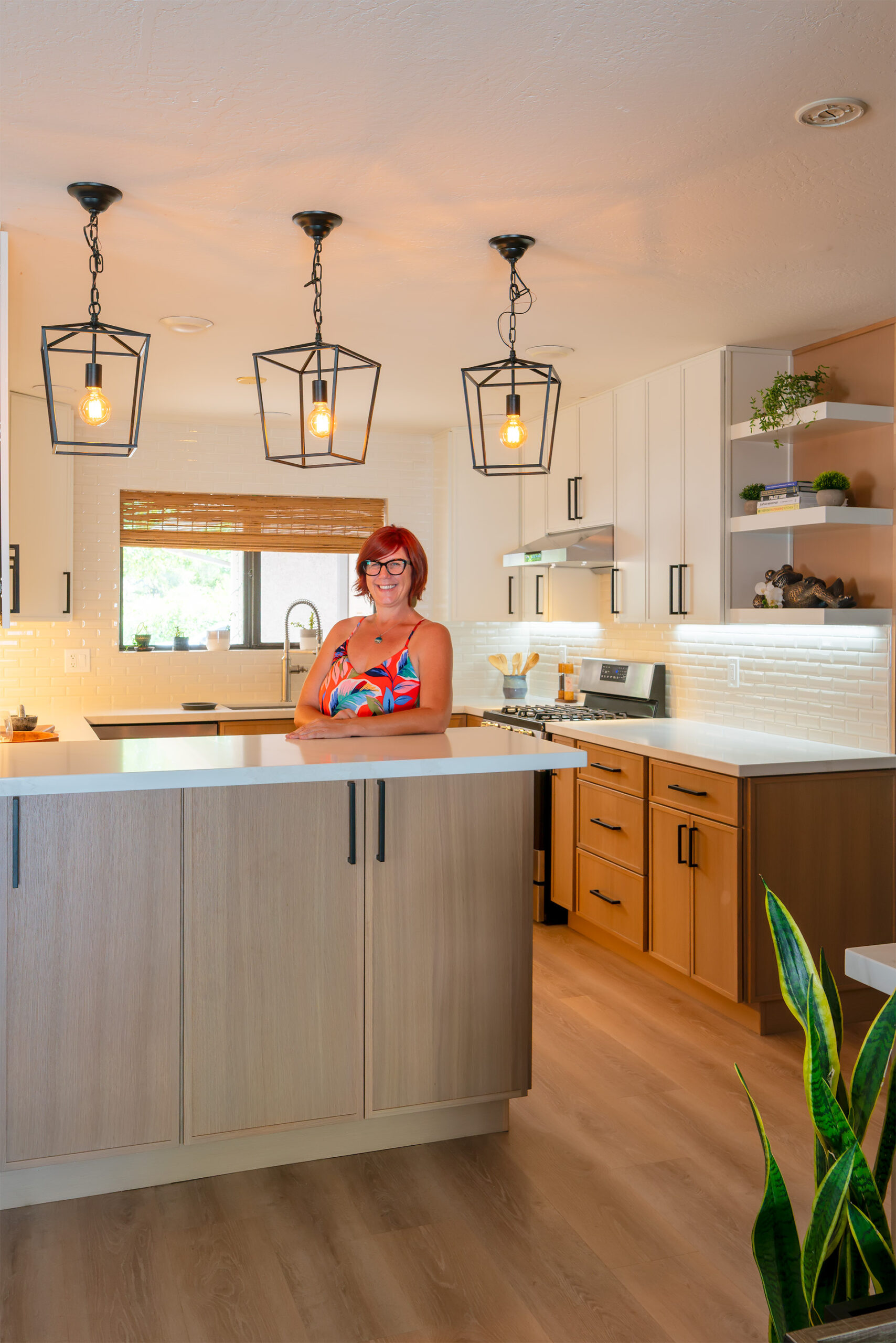 Detail of white oak cabinetry and stone countertop in the finished Phoenix kitchen